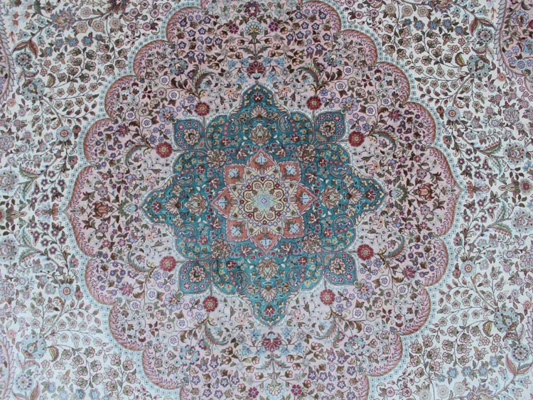 light blue color central medallion of hand-made silk rug 