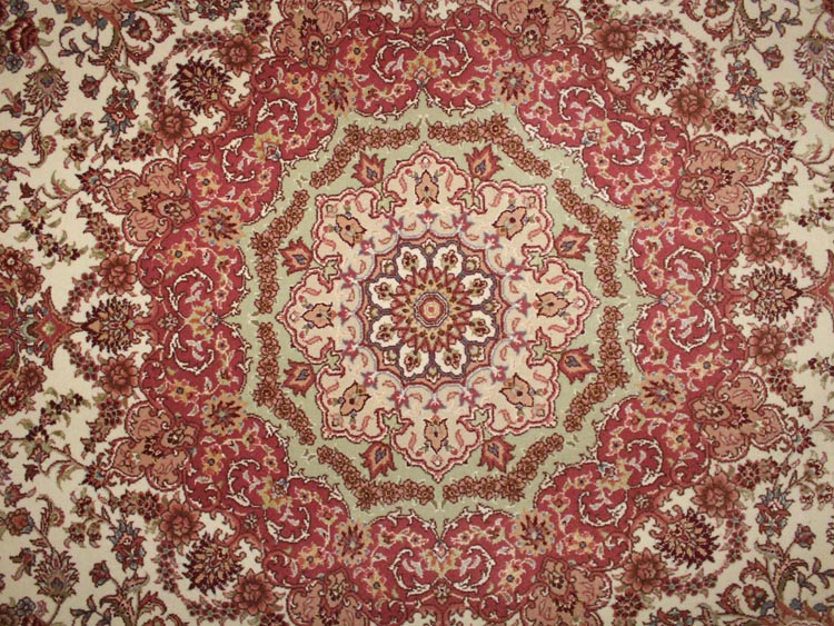 field of round shape silk and wool rug