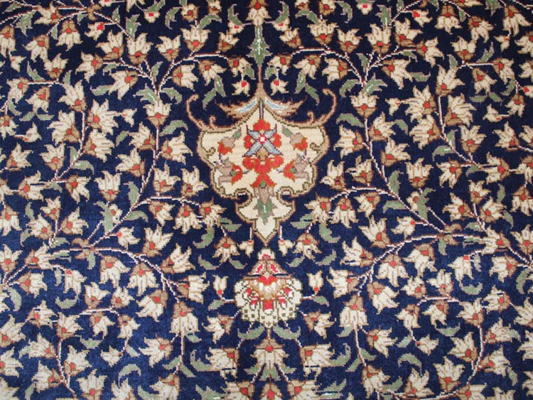 field of  oval shape silk carpet