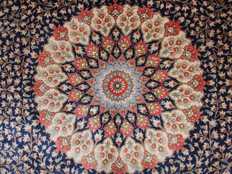 center of oval shape silk carpet
