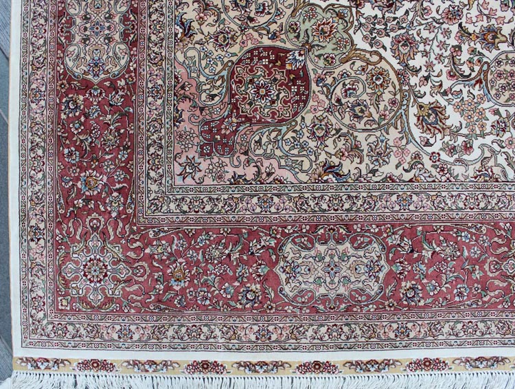 the corner of hand-made oriental silk rug